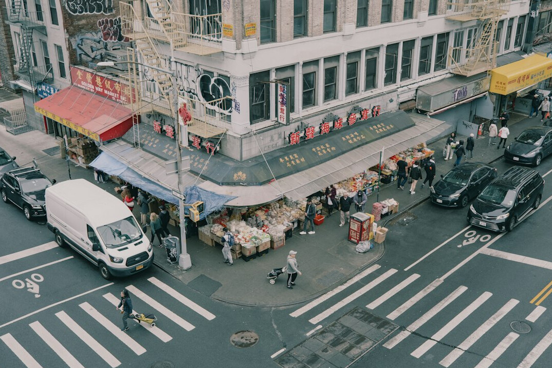 Elevated view of a busy commercial street with shoppers